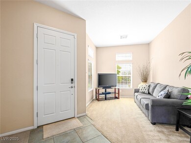 Living room with light tile patterned floors, visi