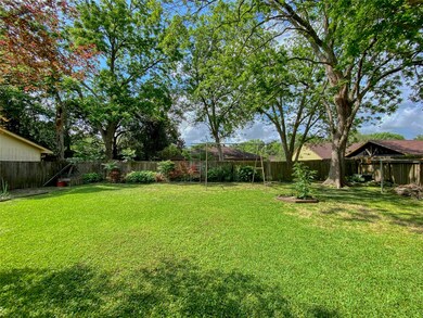 Big backyard with storage building that will stay.