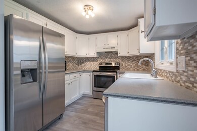 Light and bright kitchen with tiled backsplash