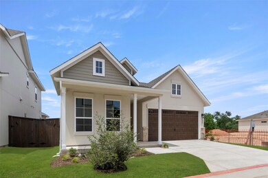 View of front of house with concrete driveway and
