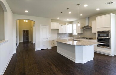 Welcoming entry into spacious kitchen with recesse