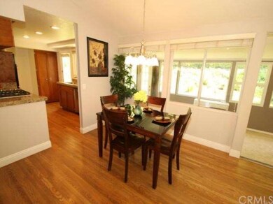 Dining area/kitchen with sun room beyond