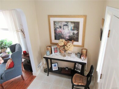 welcoming foyer leads to the living room