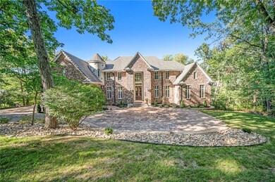 Estate sits on 1.175 acres with lots of trees and privacy. Slate roof, Hackett Stone front and heated driveway.