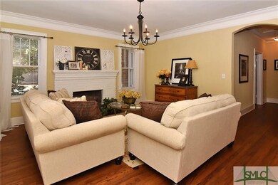 LIVING ROOM WITH FIREPLACE AND HARDWOOD FLOORS