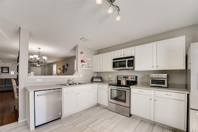 White cabinets & stainless appliances