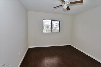 Spare room featuring ceiling fan, baseboards, and