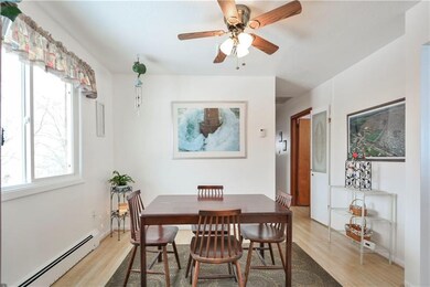 Dining Room with Laminate Flooring Open To Kitchen