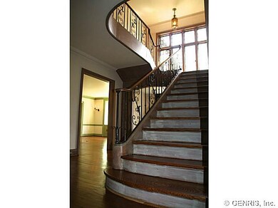 Foyer. Stately dramatic bridal staircase with exqu