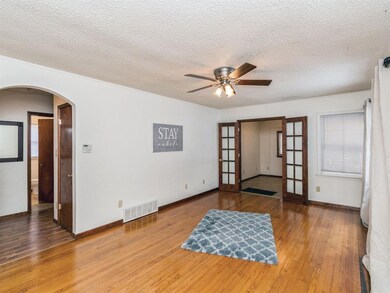 Family room with original hardwood floors, large w
