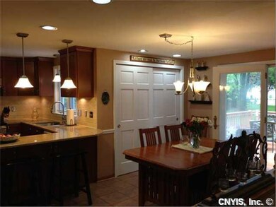 Kitchen. The open concept renovated kitchen has loads of storage and opens to the back deck.