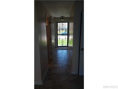 Foyer Foyer with half bath off of it leading to th