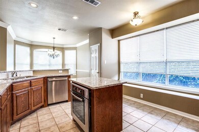 Kitchen with Bosch appliances and prep island