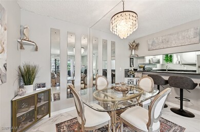 Dining space with an inviting chandelier, sink, an