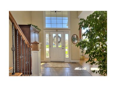 Porcelain Tile two story entry opens to Formal Din