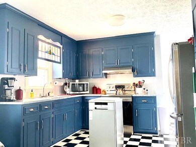 Window over the sink looks out into the fenced backyard!