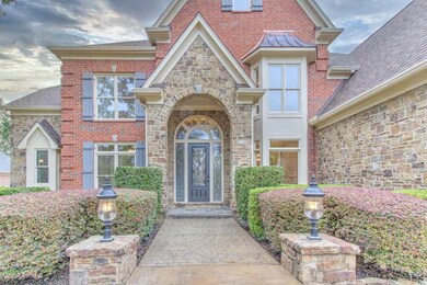 Stately exterior features brick, stone, and circul