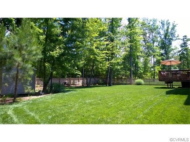 Fully fenced back yard with backing up to wooded c