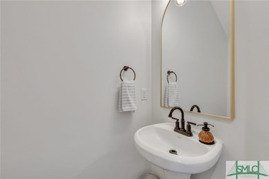 Powder room in the hallway by kitchen