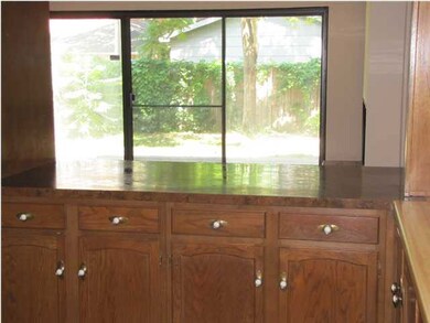 KITCHEN TO LIVING ROOM AND BACK YARD VIEW