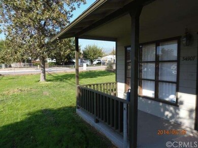Front porch looks out on new lawn.