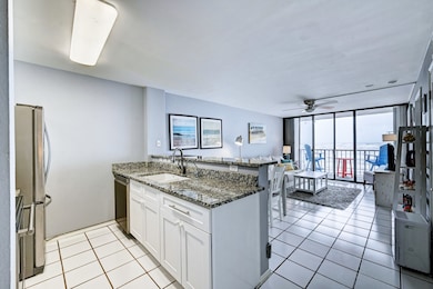 Open concept kitchen/dining/living gives Gulf view