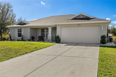 Ranch-style house featuring a garage, driveway, a 