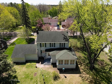 View of subject property with a forest