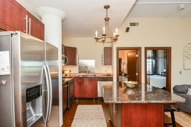 The Chef's island kitchen boasts custom cherry woo