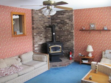 Living room woodstove and hearth.
