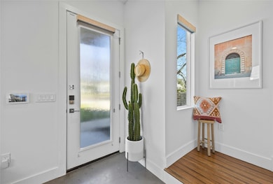 Foyer entrance with baseboards
