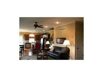 Great room has gas fireplace and space for flat sc