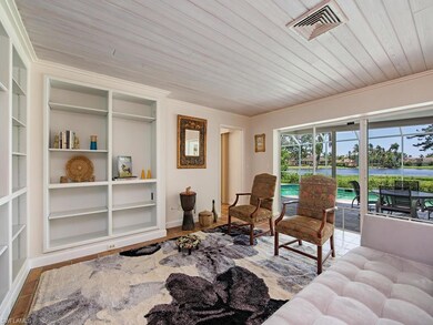 The living room with sliding glass doors open to t
