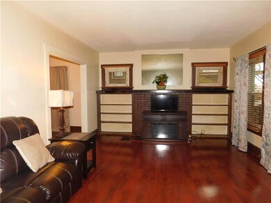 Spacious living room with a newer floor, charming 
