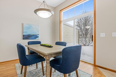 Dining room has sliding glass doors to lead out to the private end unit deck