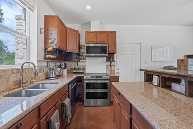 Kitchen with stainless steel appliances, light st