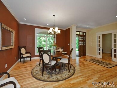 Open dining room w/chandelier