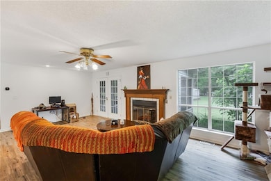 Living room featuring light wood-type flooring, fr