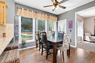 Eat-in kitchen with gorgeous refinished hardwoods