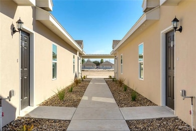 View of side of home featuring stucco siding