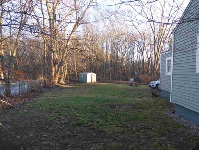 Land on side of the house leading into back yard with Shed.