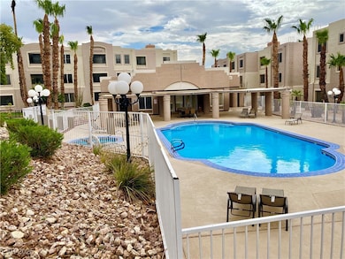 Pool with fence and a patio area