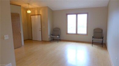 Walk into a large open floor plan with vaulted ceilings.