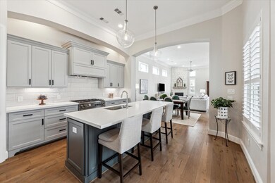 At the center of the kitchen is a large island des