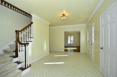 Entry has a beautiful oak railing and nice wood un