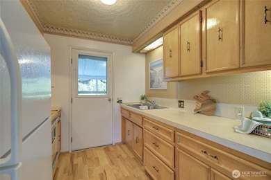 Galley kitchen with quality wood cabinets