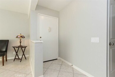Light and soothing inside with tile floor and gray walls.