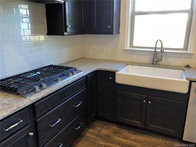 Gas cooktop and farm sink