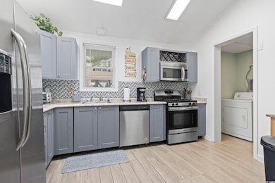 Kitchen with stainless steel appliances, washer / 