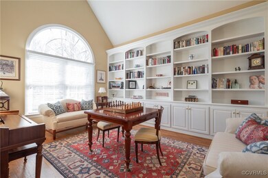 Library/office with cathedral ceiling and wall of